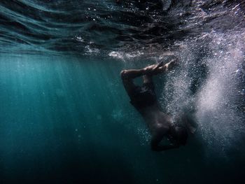 Man scuba diving in sea