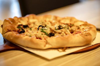 Close-up of pizza in plate on table