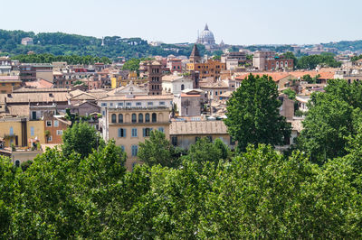 High angle view of trees and buildings against sky