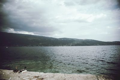 Scenic view of sea against cloudy sky