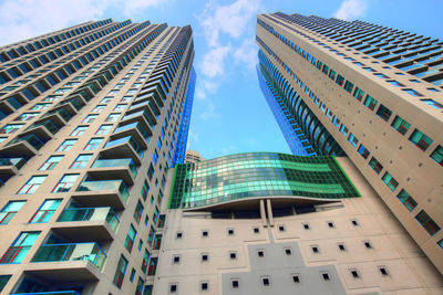 Low angle view of modern buildings against sky