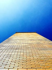 Low angle view of tower against clear blue sky