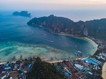 High angle view of sea and buildings against sky