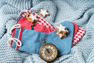 High angle view of christmas ornaments on snow