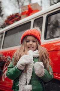 Portrait of young woman in car