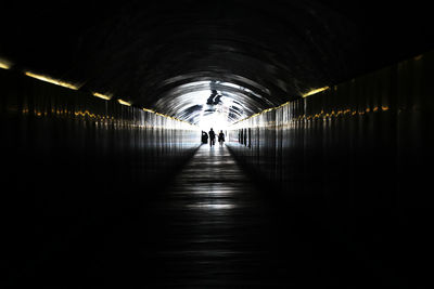 People walking in tunnel