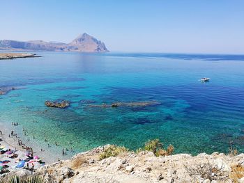 Scenic view of sea against blue sky