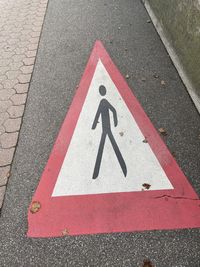 High angle view of arrow sign on road