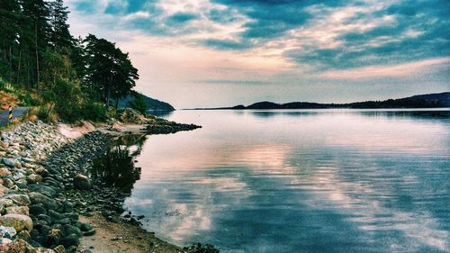 Scenic view of lake against sky during sunset