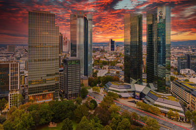 High angle view of buildings in city during sunset