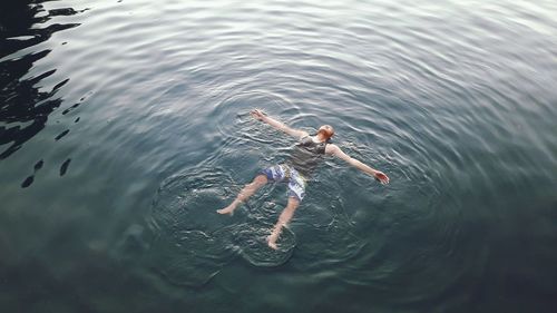 High angle view of man swimming in sea