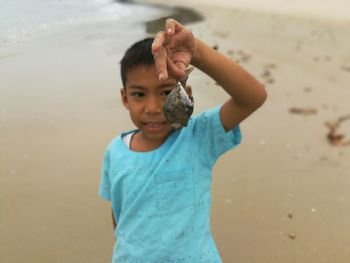 Portrait of cute boy on beach