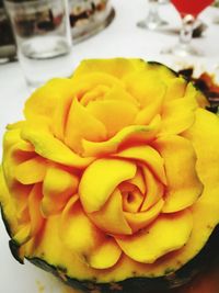 Close-up of yellow flower in plate