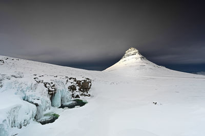 Scenic view of snowcapped mountain against sky