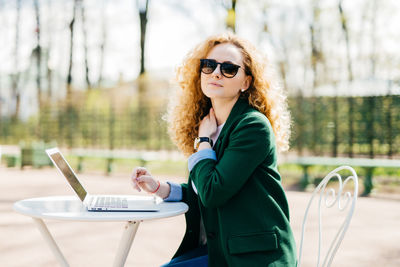 Portrait of woman using mobile phone