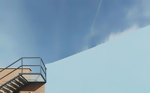 Low angle view of staircase against sky