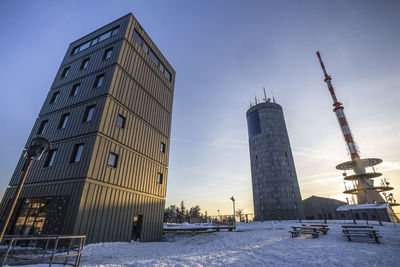 Low angle view of building against sky during winter