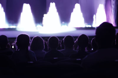 Audience in illuminated auditorium