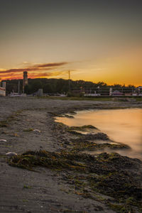 Buildings in city at sunset