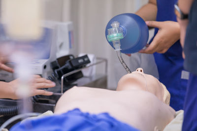 Cropped image of person learning cpr in hospital