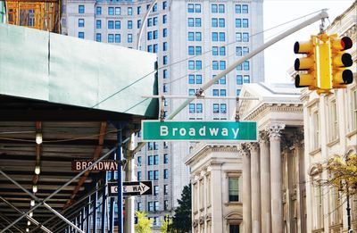 Traffic signal and road signs in city