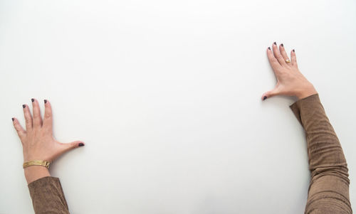 Low section of people against white background