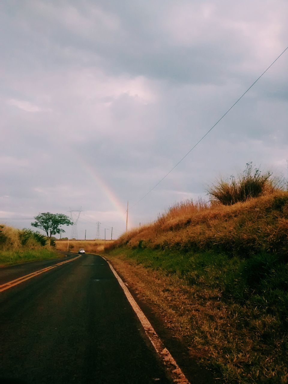 the way forward, diminishing perspective, sky, transportation, vanishing point, road, cloud - sky, cloudy, electricity pylon, power line, country road, empty road, cloud, road marking, nature, weather, landscape, overcast, tranquility, connection