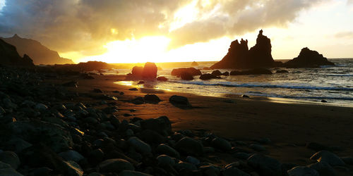 Panoramic view of sea against sky during sunset