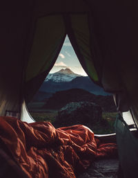 Mountains seen through tent at sunset