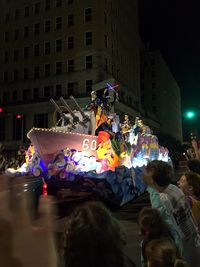 People on street in city at night