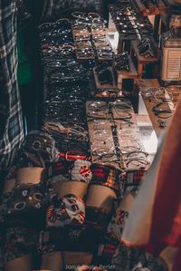 High angle view of eyeglasses for sale at night market