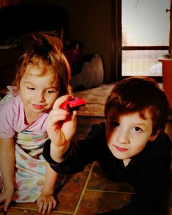 Brother and sister playing at home