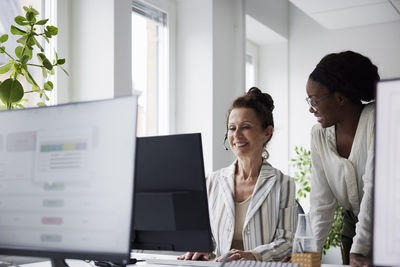 Female colleagues working in call center