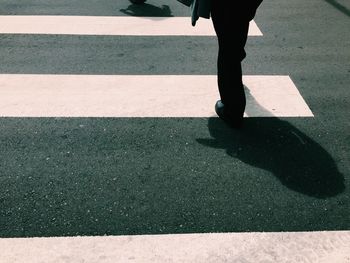 Low section of people walking on road