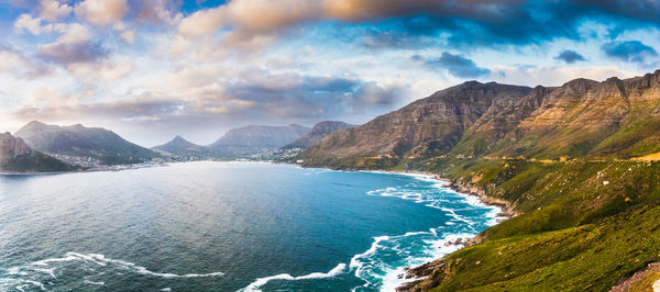 Panoramic view of sea and mountains against sky