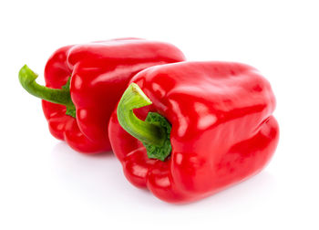 Close-up of red bell pepper against white background