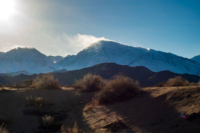 Scenic view of snowcapped mountains against sky