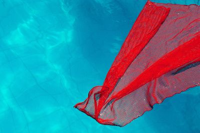 Low angle view of cloth against swimming pool