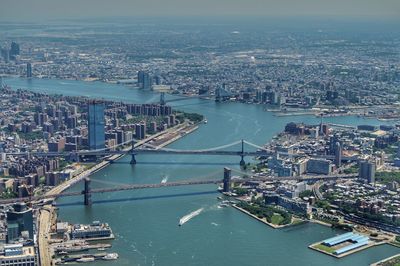 High angle view of river and buildings in city