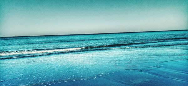 Scenic view of sea against clear sky