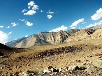 Scenic view of arid landscape against sky