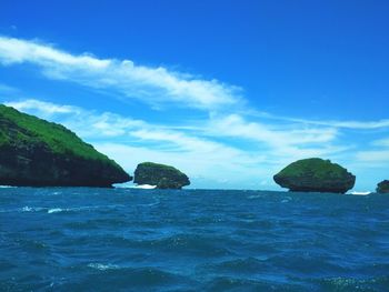 Scenic view of sea against blue sky