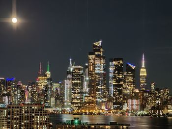 Illuminated buildings in city at night