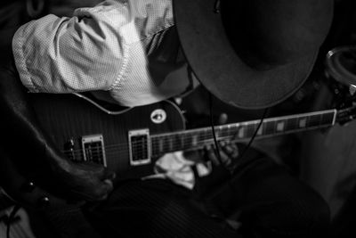 Close-up of man playing guitar