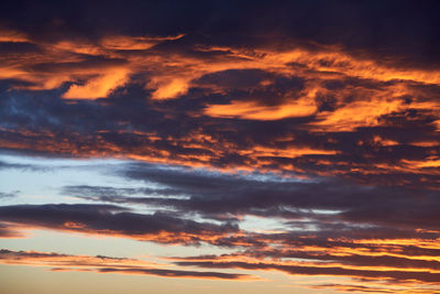 Low angle view of dramatic sky during sunset