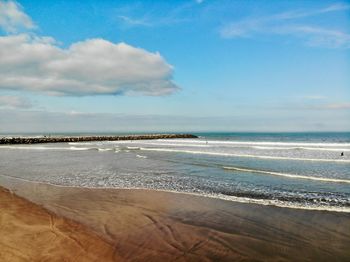 Scenic view of beach against sky