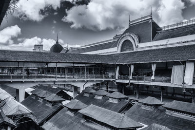 View of buildings against cloudy sky