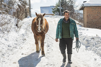 Full length of a horse on snow