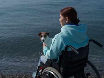 Side view of woman with dog