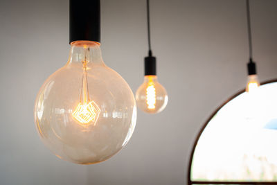 Close-up of illuminated light bulb
